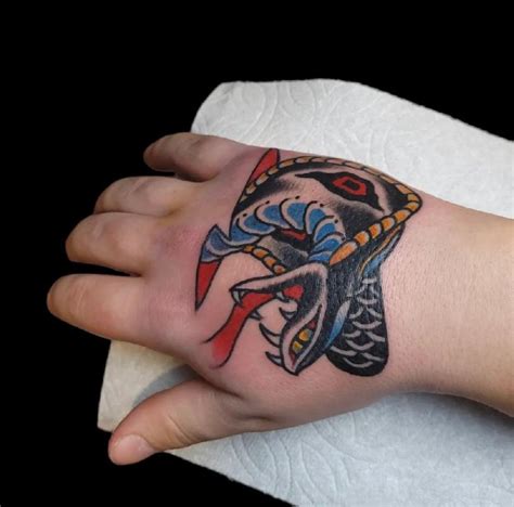 american traditional snake head tattoo.